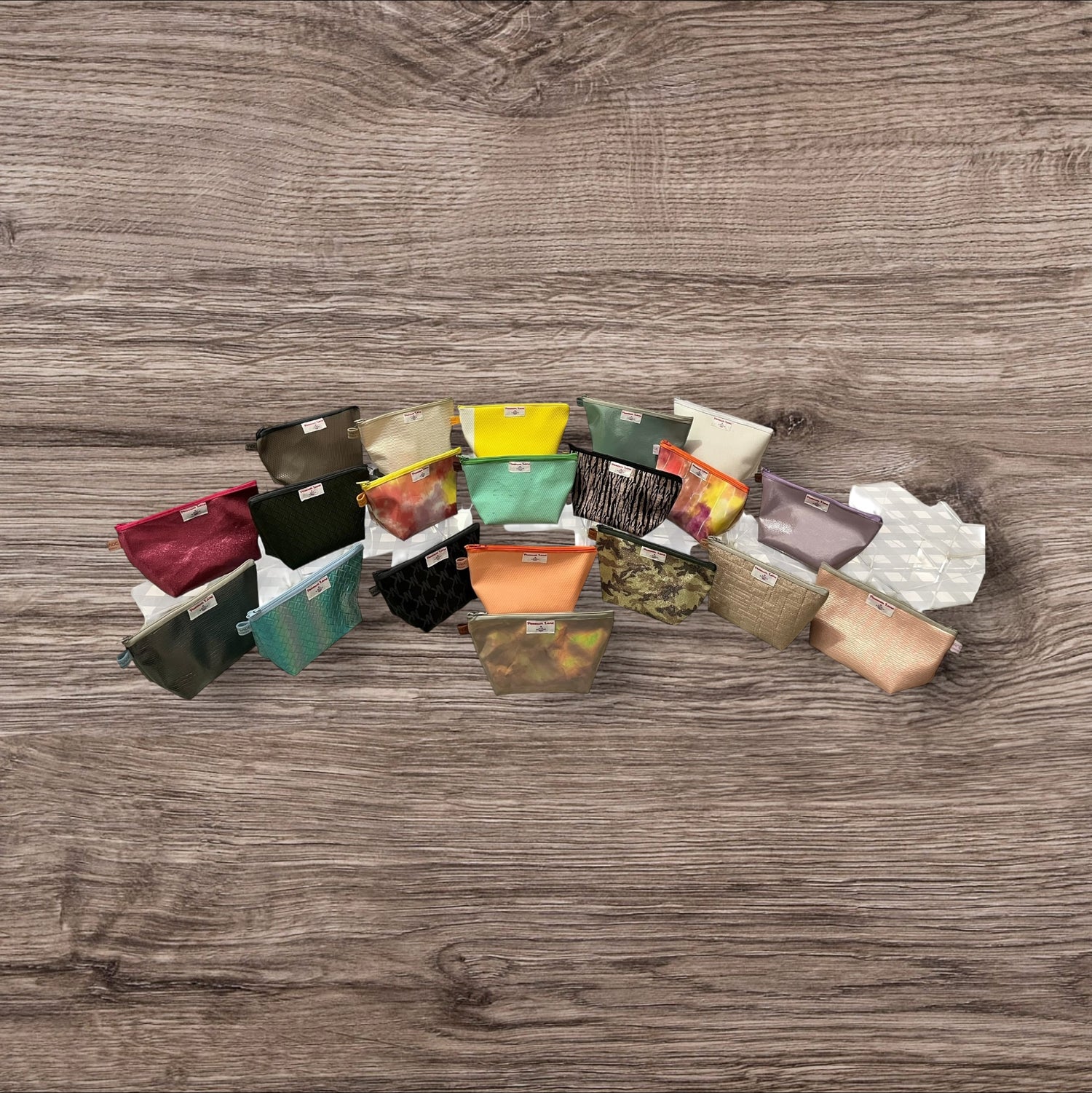 Assorted small bags on a wooden surface